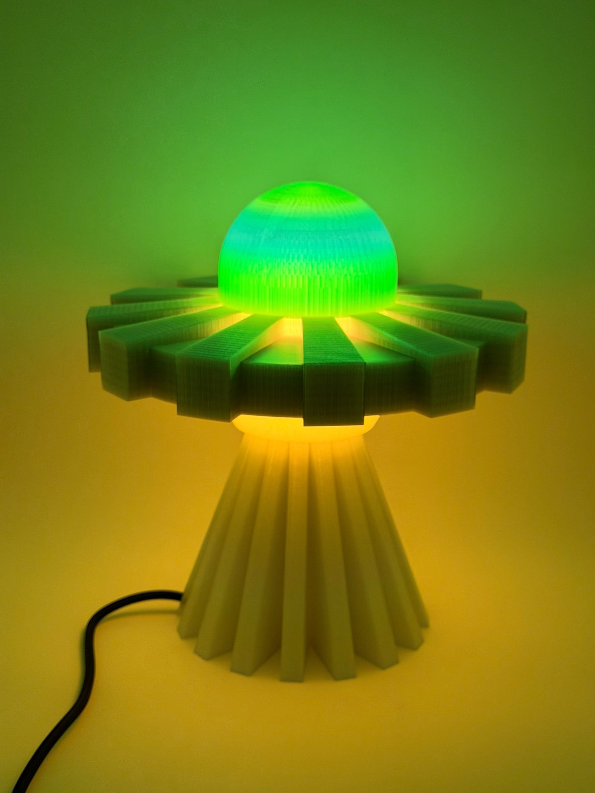 Neon green UFO lamp switched on, casting an alien-green glow over the wall