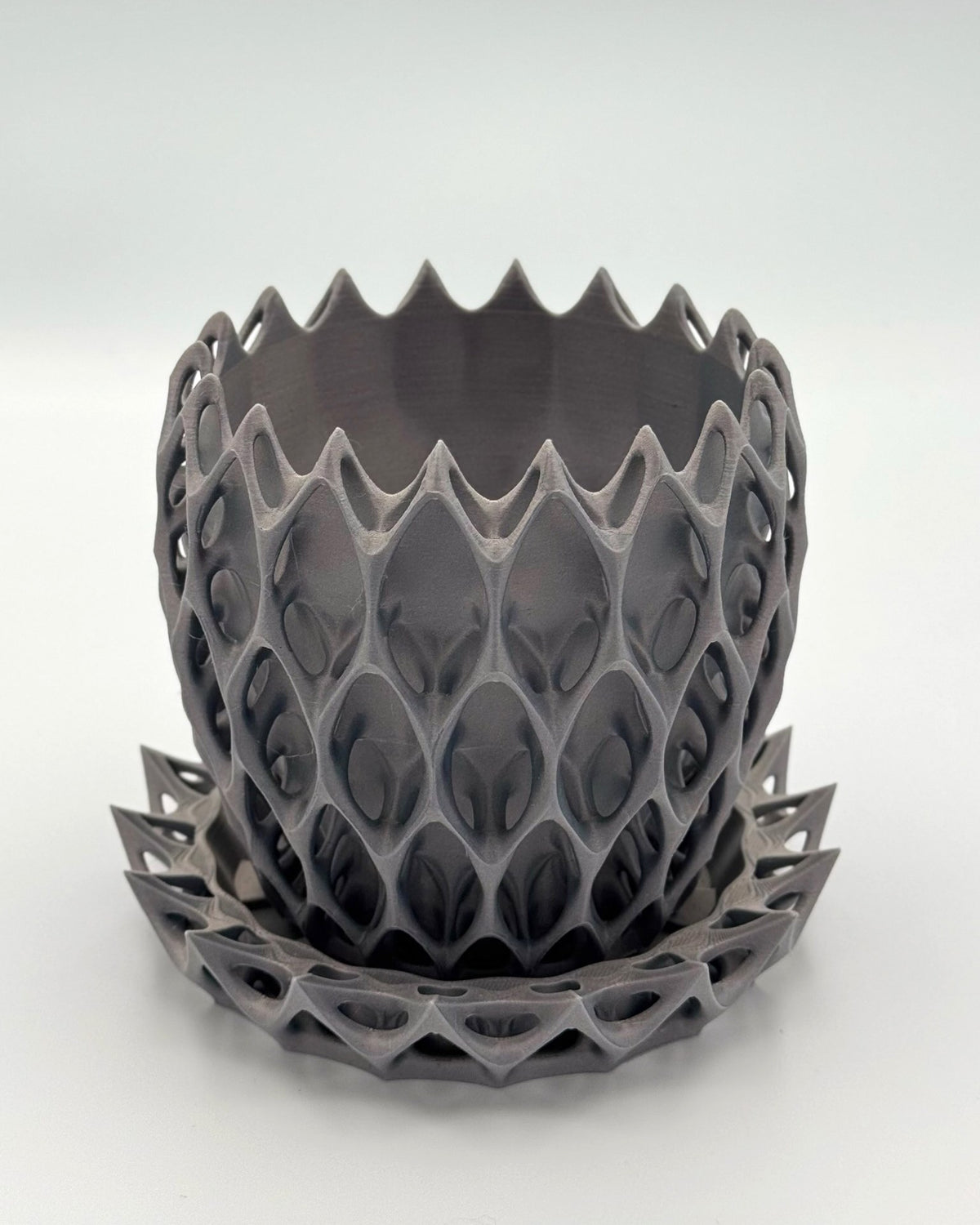 Silver gray Alien Seed 3D printed planter pot with lattice pattern and matching saucer