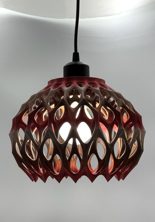Red to silver metallic Alien Seed Pod 3D printed pendant lamp glowing