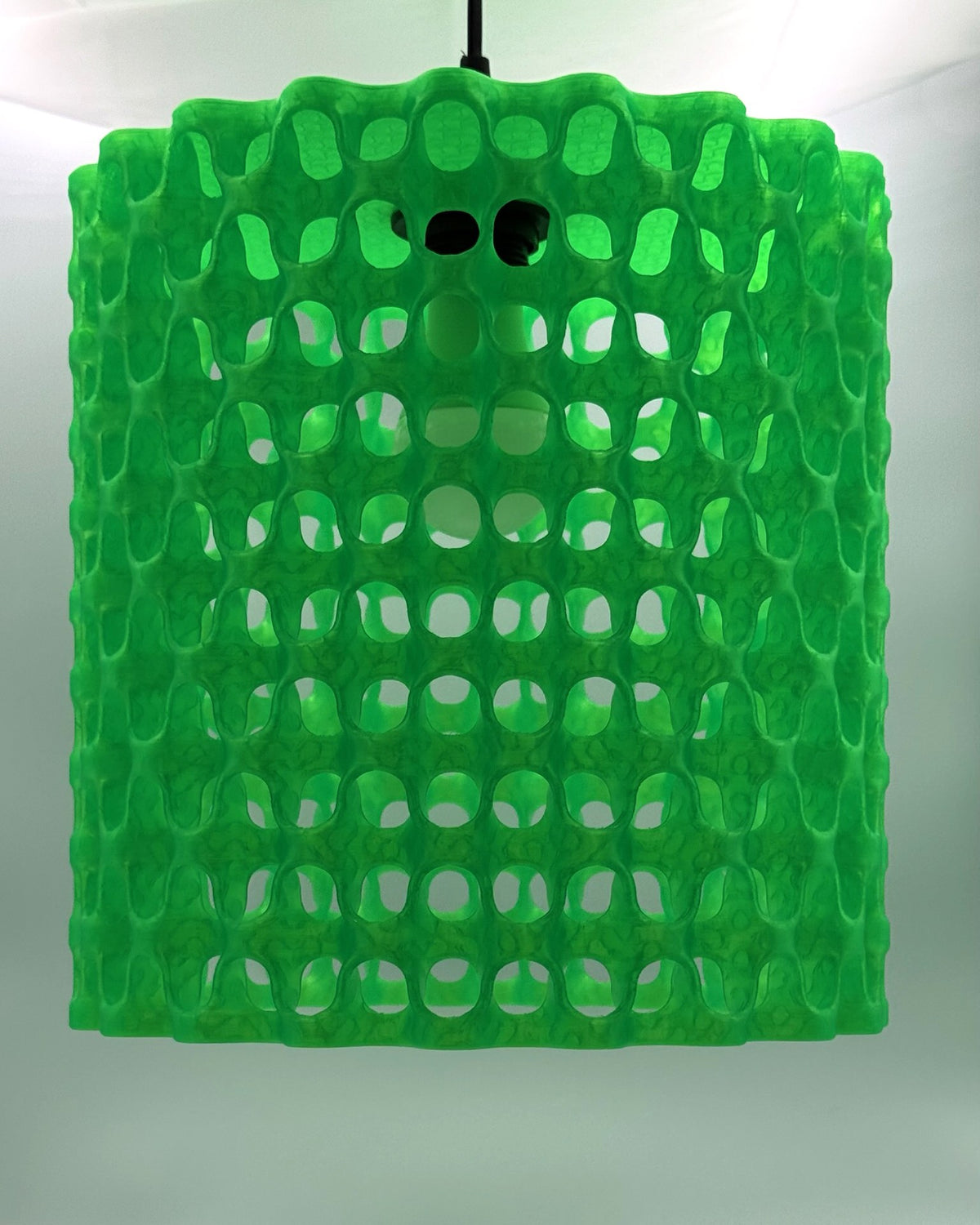 Neon green Alien Waffle 3D printed pendant lamp with wavy lattice shade