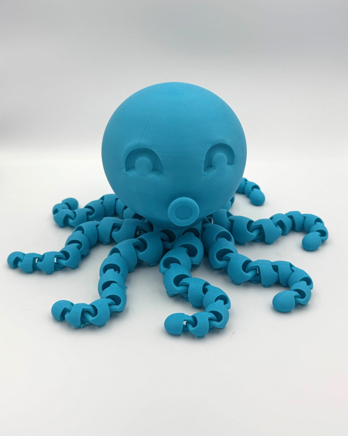 Cyan Kraken 3D printed octopus totem with articulated tentacles