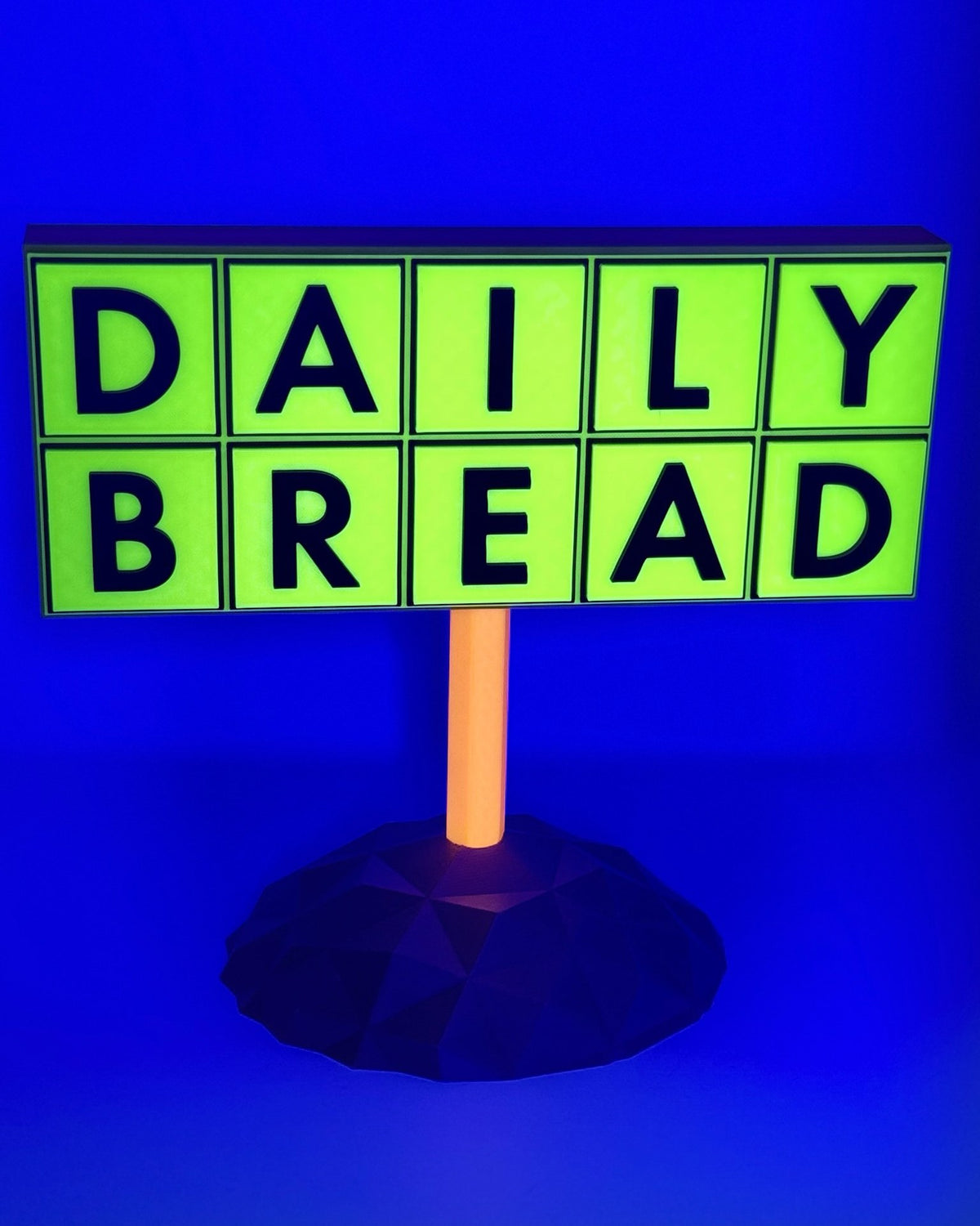 Daily Bread totem glowing under blacklight
