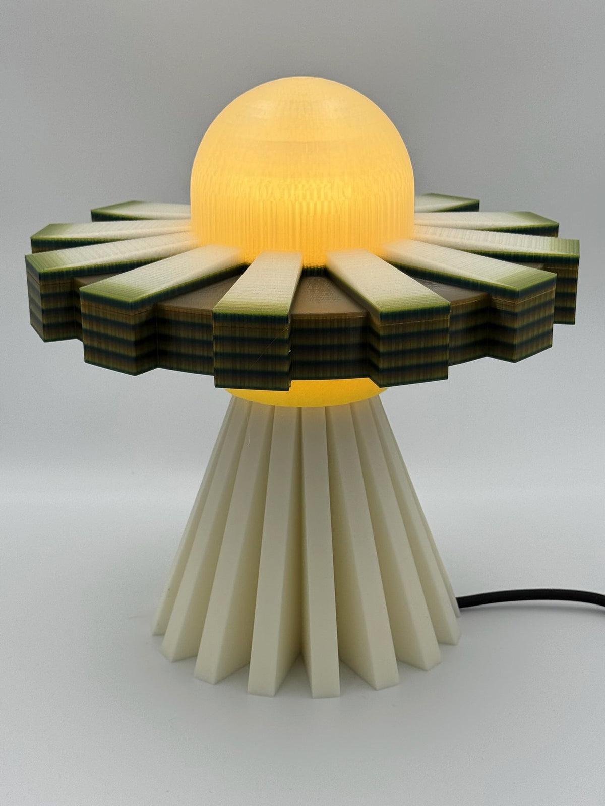 Lemon and Cream UFO lamp with glowing yellow dome and cream base