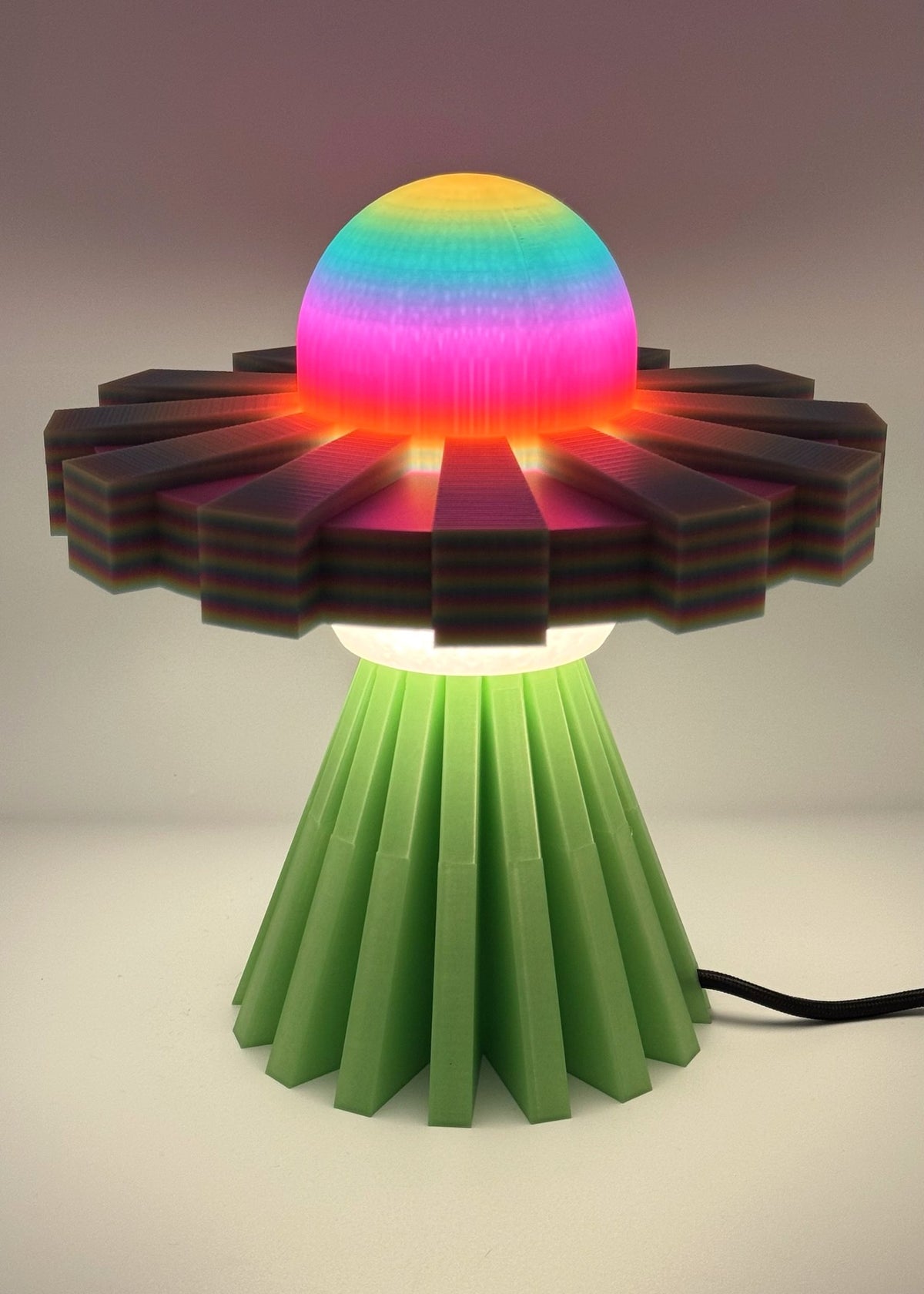 Rainbow and Green UFO lamp glowing in rainbow colors