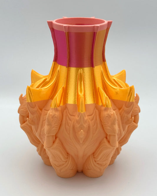 Extraterrestrial 3D printed flower vase in peach, metallic gold and coral with alien faces