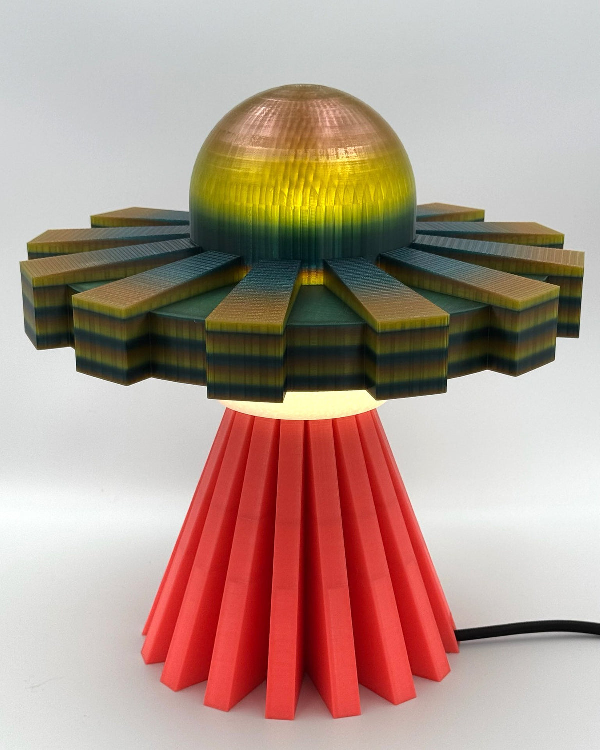 Iridescent metallic UFO lamp with coral red base