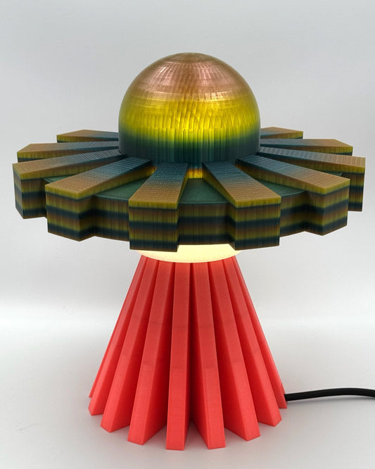 Iridescent metallic UFO lamp with coral red base