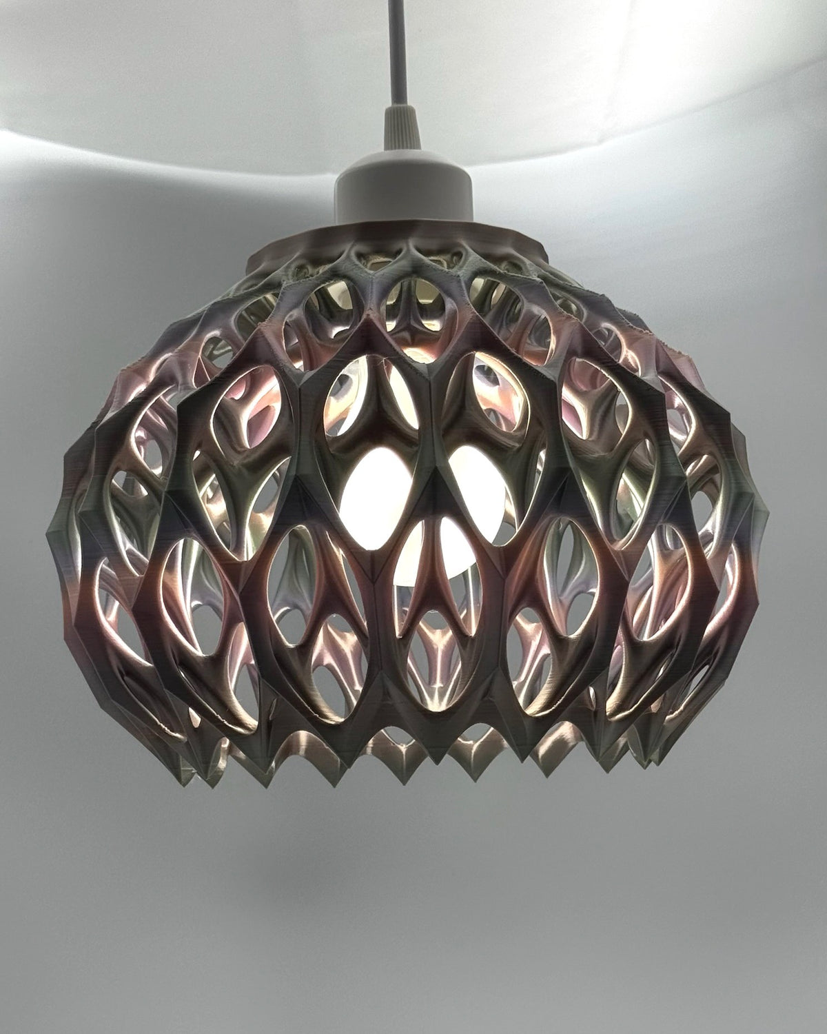 Pink metallic Alien Pod 3D printed pendant lamp glowing