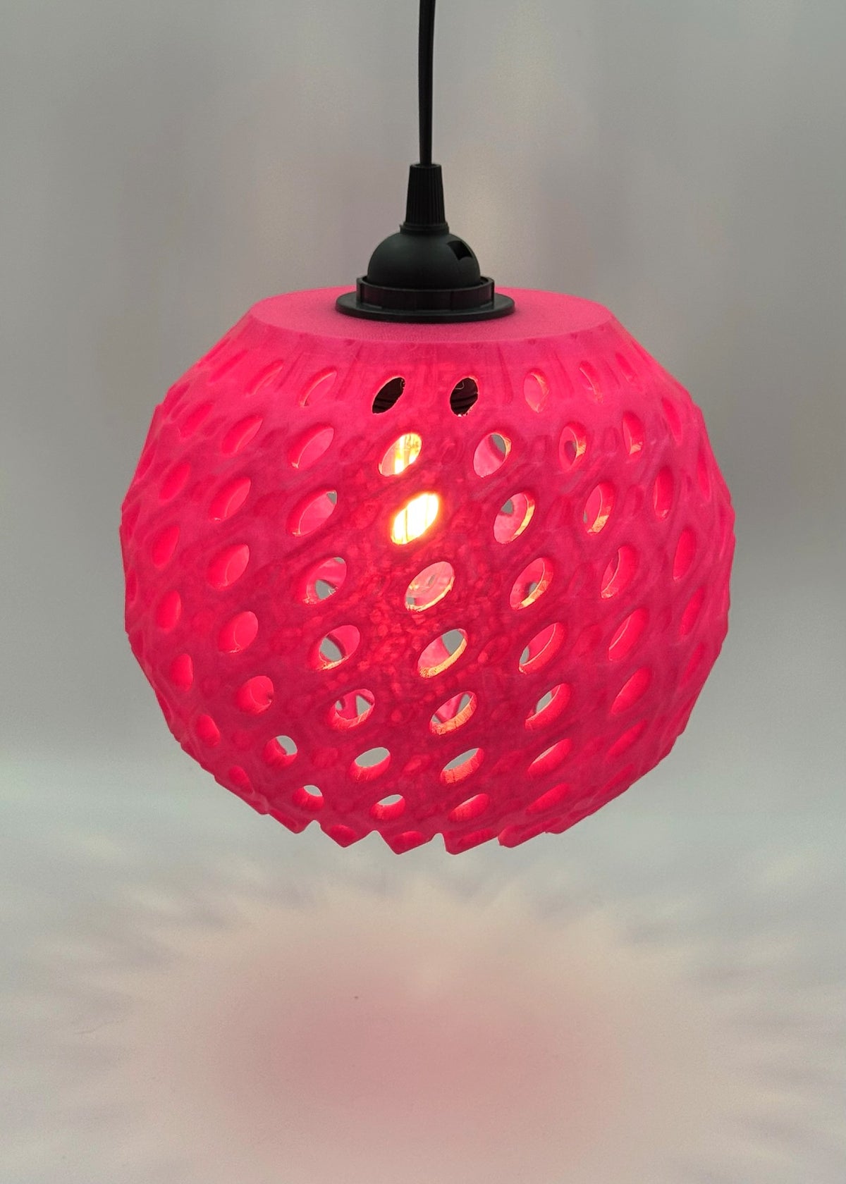 Hot pink Pink Pineapple 3D printed pendant lamp glowing