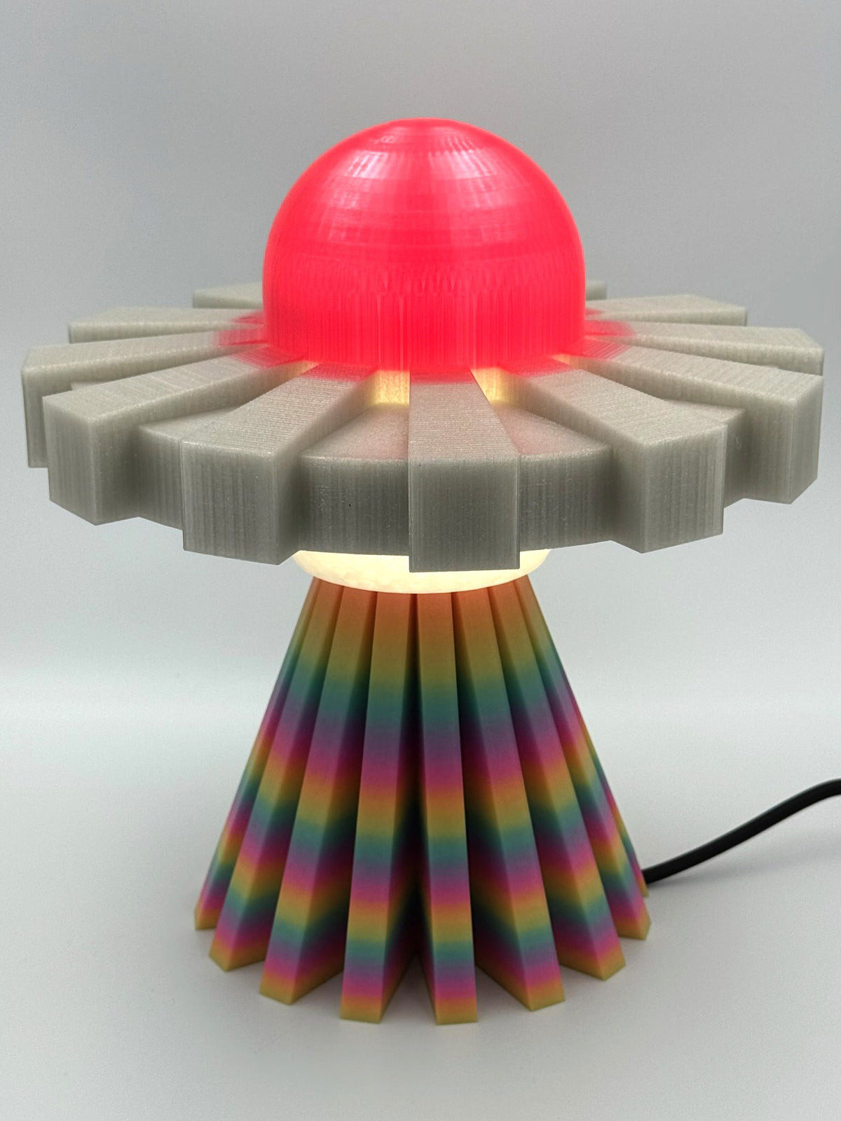 Red and rainbow UFO lamp, front view