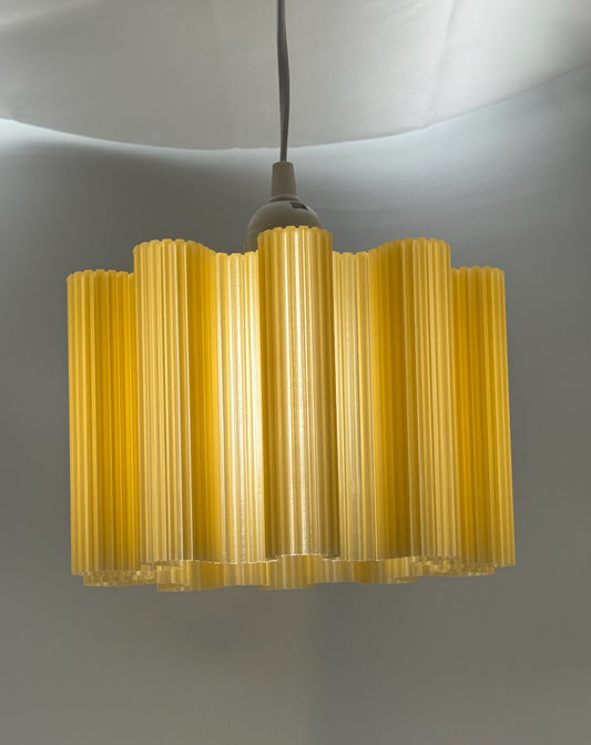 Warm Glow Wavy 3D printed pendant lamp glowing honey gold
