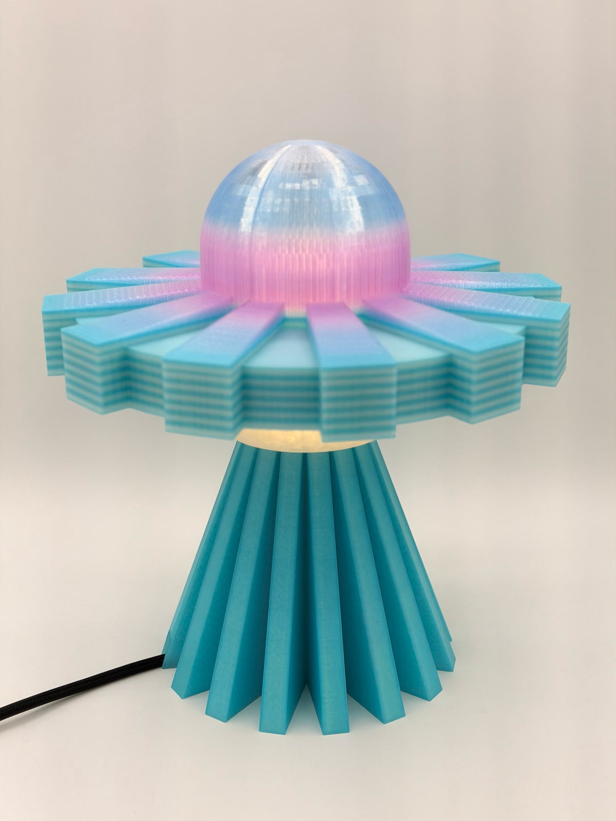 Retro UFO LED desk lamp, 3D printed, with pastel pink and blue dome, striped turquoise saucer and pleated teal base