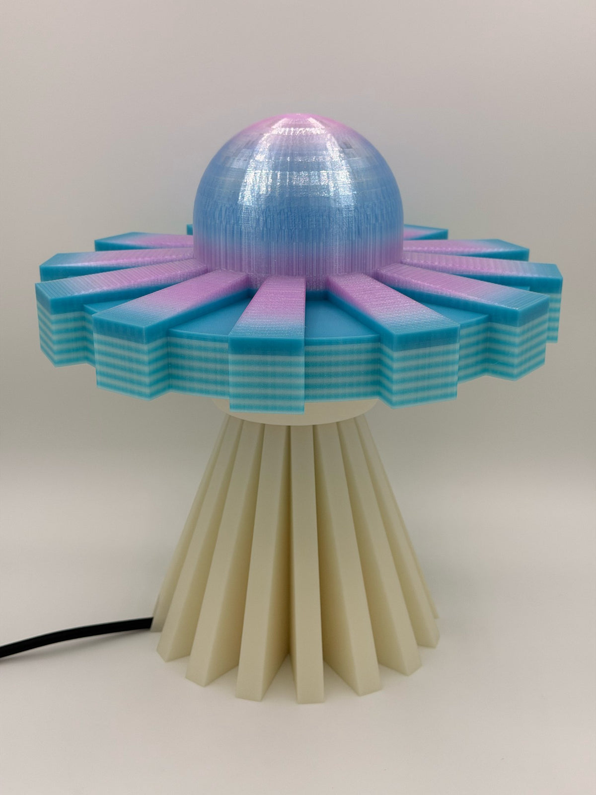 Cotton candy and cream 3D printed UFO lamp with blue-to-pink dome, turquoise saucer and cream base