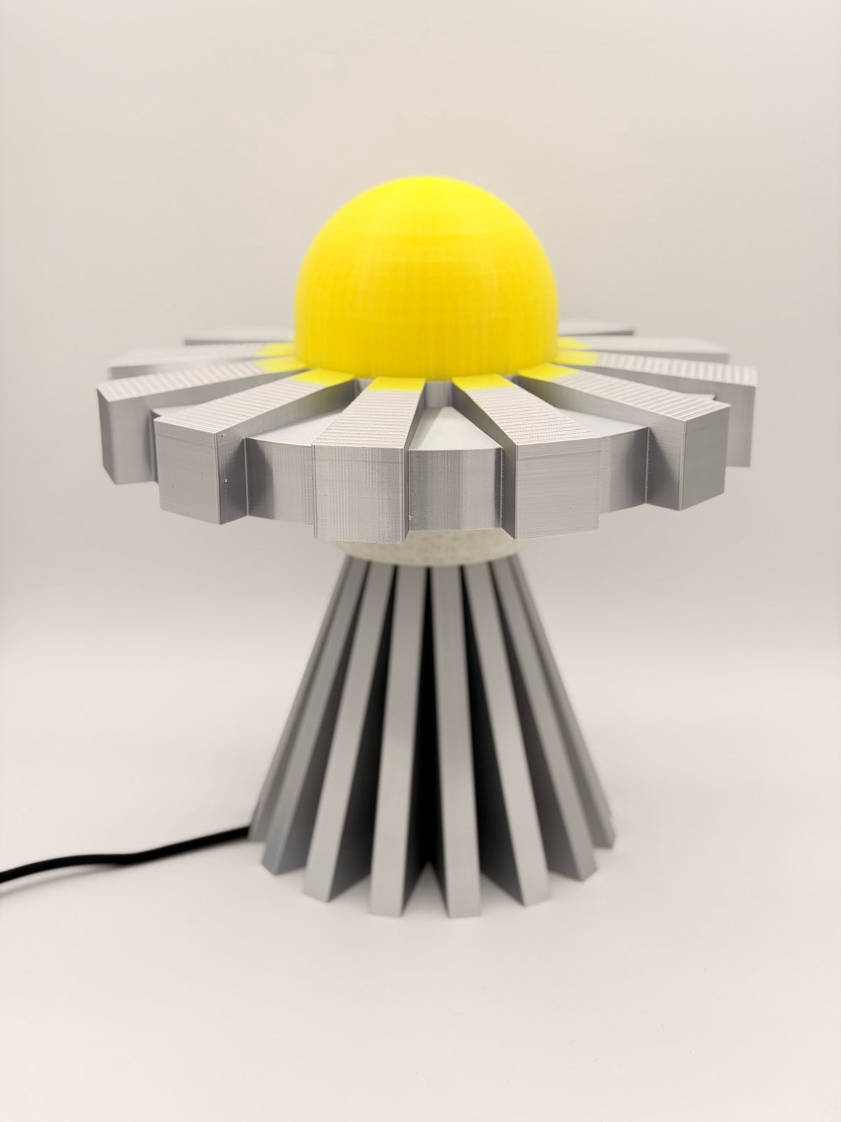 Lemon and silver 3D printed UFO lamp with yellow dome and metallic silver saucer and base