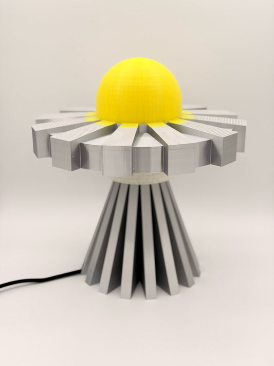 Lemon and silver 3D printed UFO lamp with yellow dome and metallic silver saucer and base