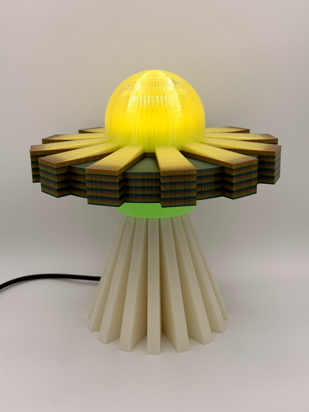 Lemon and cream 3D printed UFO lamp with yellow dome, yellow and black saucer and cream base